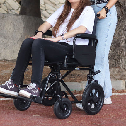 Lightweight folding wheelchair (steel construction 15 kg), foldable armrests and footrests, puncture-proof tires